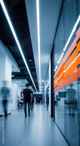 Blue Lit Office Corridor Blurred People Walking Orange Accents