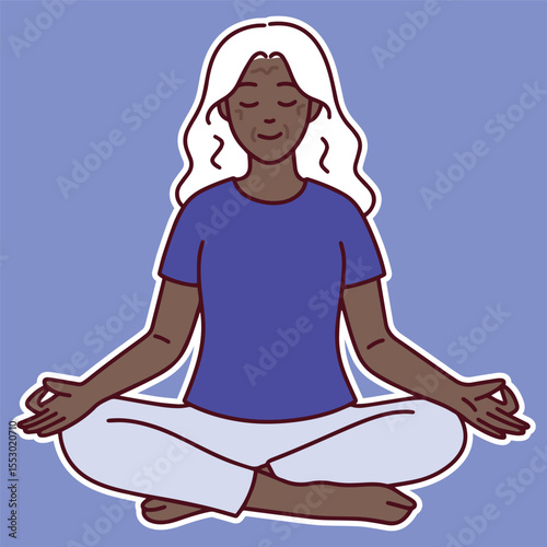 Dark-skinned senior woman sits calmly in lotus pose with closed eyes, practicing meditation and breathing for wellness and mental clarity