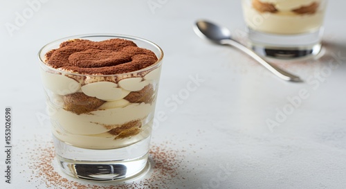 Indulge in the creamy, coffee-infused delight of homemade tiramisu, elegantly presented in a glass.