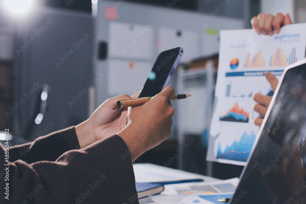 © Natchanida - Focused young businessman signing agreement with skilled lawyer in eyeglasses. Concentrated financial advisor showing place for signature on paper contract document to male client at meeting in office © Natchanida - Focused young businessman signing agreement with skilled lawyer in eyeglasses. Concentrated financial advisor showing place for signature on paper contract document to male client at meeting in office