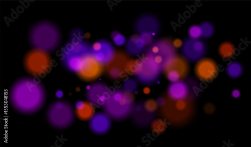 Multicolored blurred bokeh particles with violet, blue, pink hues floating on black background, creating festive or dreamy abstract composition.