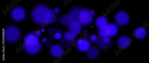 Blue blurred bokeh particles with varying size and opacity on black background. Abstract design element for festive or sci-fi scenes.