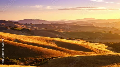 Golden sunset hills, rural landscape, distant mountains, farmland; travel/tourism