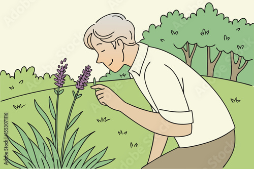 Senior man smelling lavender in lawn