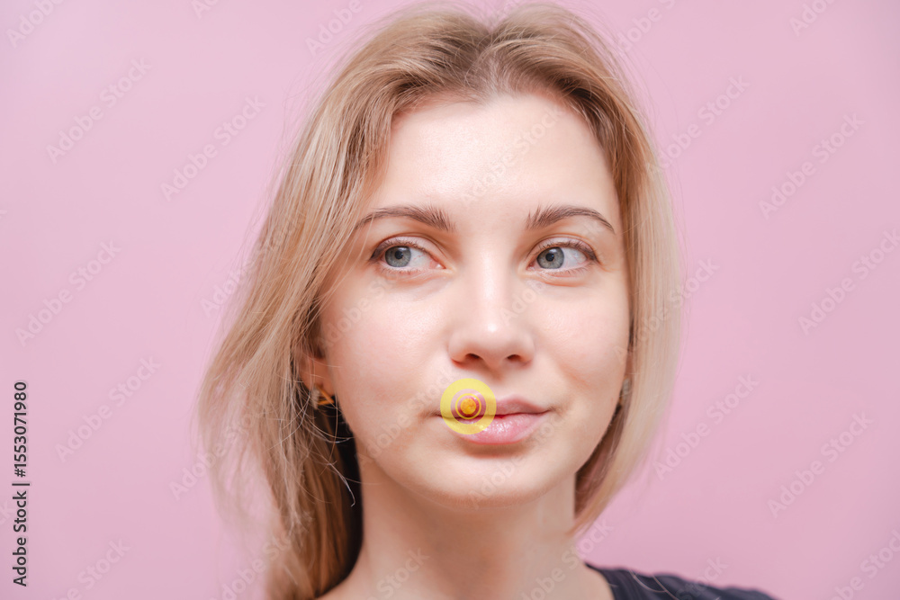 Young woman with herpes cold sore on mouth against pink background. Herpes blisters Young woman with herpes cold sore on mouth against pink background. Herpes blisters