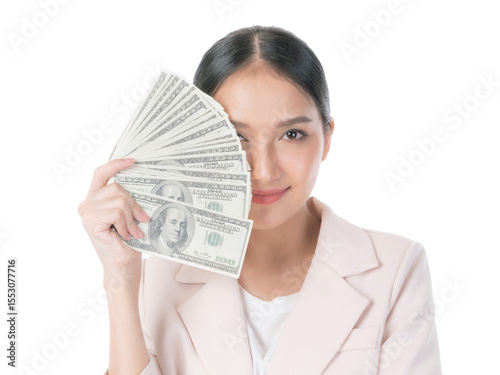Confident Asian businesswoman smiling and holding fan of US dollar bills covering one eye, symbolizing financial success, wealth, savings, and investment, isolated on a transparent background