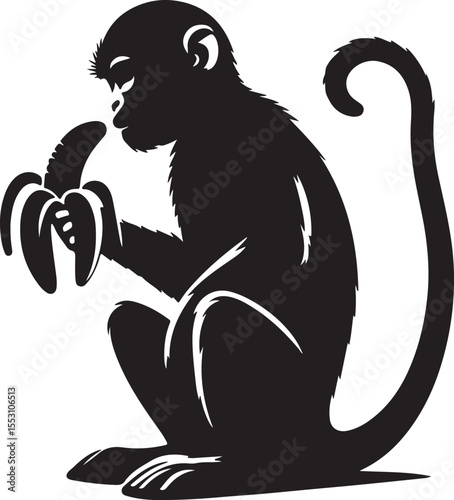A silhouette monkey is eating banana