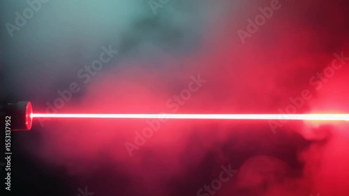 Laser experiment showcasing red light beam in a smoky environment during evening hours