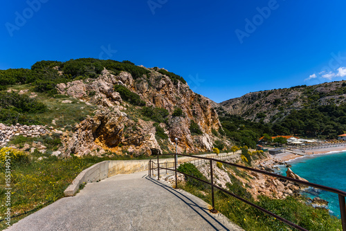Fototapeta Naklejka Na Ścianę i Meble -  Naturist beach and Bunculuka campsite on the island of KRK, azure waters of the Mediterranean Sea, FKK