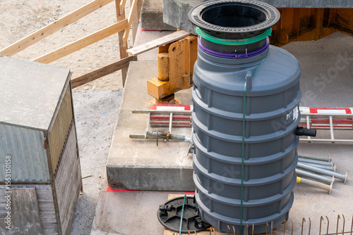 Sewage water equipment standing on a construction site of an apartment house.