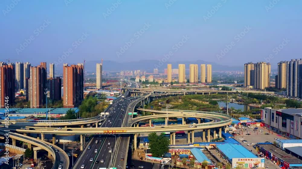 Aerial view of traffic flow over Shijiazhuang Southwest Second Ring Road overpass during clear weather