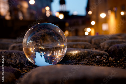 Close-up of a crystal ball on cobblestone