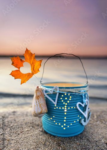 Nautical Lantern with Autumn Leaf at Sunset Beach