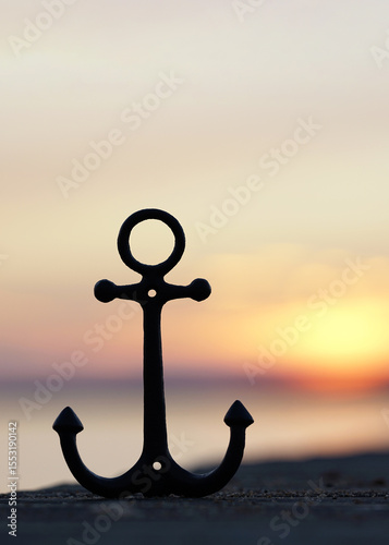 Anchored in Serenity: iron anchor Symbol by the Sunset Sea