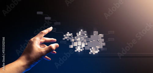 hand of businessman interactive touching a holographic of transaction financial network data system, concept of technology artificial intelligence with human user application