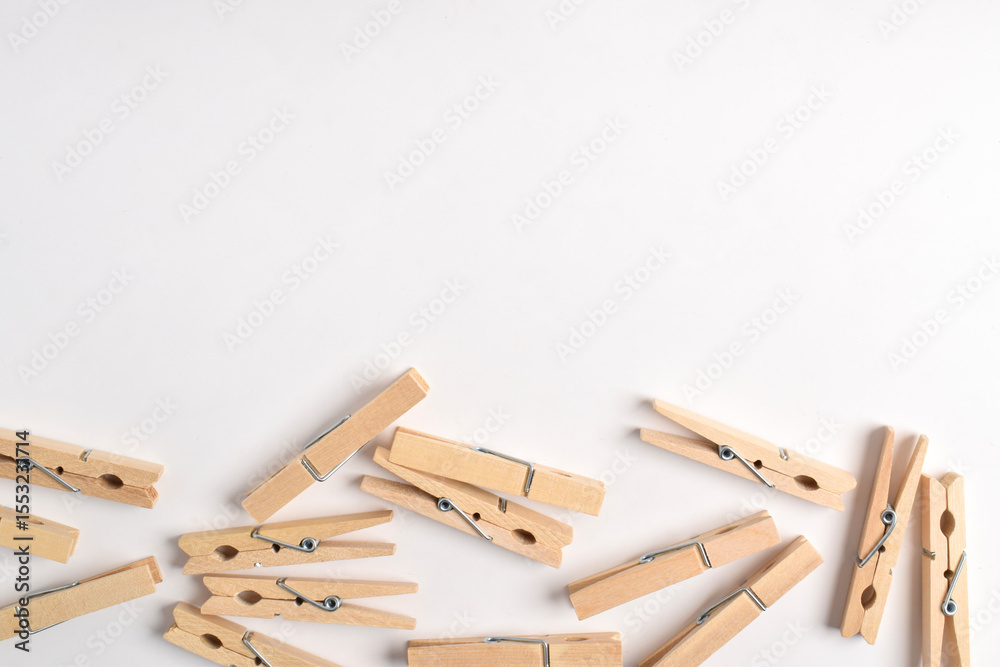 Wooden clothes pin isolated on white background. Top view, flat lay Wooden clothes pin isolated on white background. Top view, flat lay