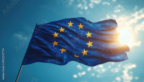 blue flag with twelve yellow stars waving against a bright sunlit sky with scattered clouds