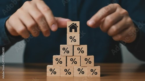 A conceptual image showcasing mortgage interest rates, symbolized by wooden blocks with percentage signs and a house icon