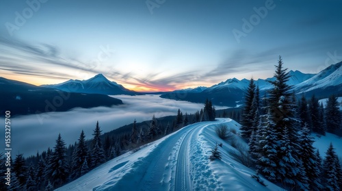 Lonely snow trail winding through winter mountains