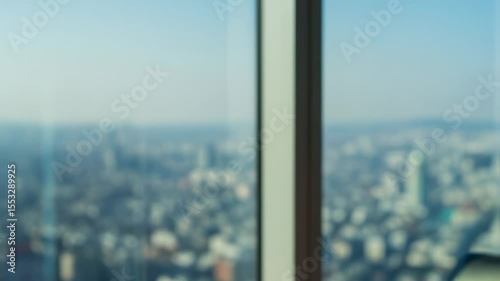 Woman in pink blazer with cityscape background
