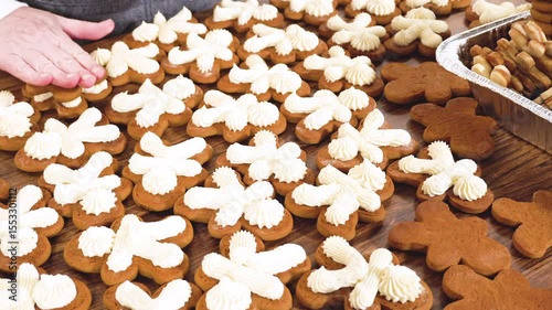 Making Festive Gingerbread Sandwiches on Rustic Wooden Table