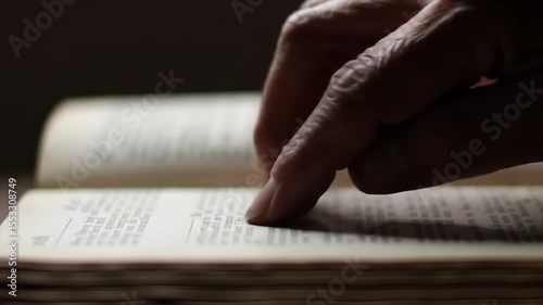 Finger Tracing Text on Book Page