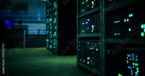 In the darkened data center, server racks glow with green and blue lights. The atmosphere is quiet, emphasizing the importance of technology during late night operations, highlighting server activity.