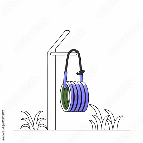 Garden hose neatly hanging on a hook in outdoor garden setting  