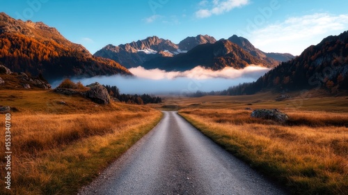 A captivating view of a scenic road winding through majestic mountains and lush fields, enveloped by mist, representing nature's beauty and the journey of life.