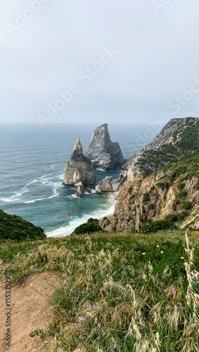 Craggy cliffs embrace mythic ocean whispers, echoing Beltane's wild embrace and Solstice's eternal dance by the edge