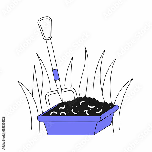 Compost bin with garden fork filled with worms in grassy area  