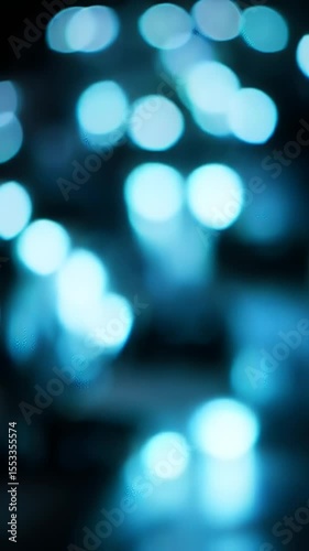 Dynamic Vertical Bokeh Lights Shifting Color on Dark Background Loop