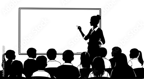 A teacher stands at a whiteboard in front of a classroom of attentive students all facing the front of the room ready to learn and absorb information