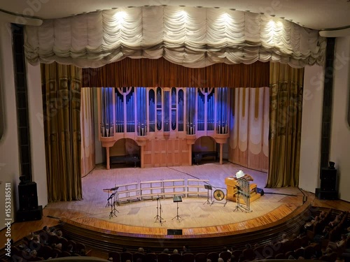 SAMARA - APR 16, 2024: The philharmonic stage is filled with a variety of musical instruments, including a piano and a keyboard. The piano is situated in the center of the stage, while the keyboard is