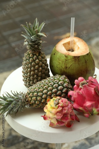 Fototapeta Naklejka Na Ścianę i Meble -  Different fresh fruits on white table outdoors