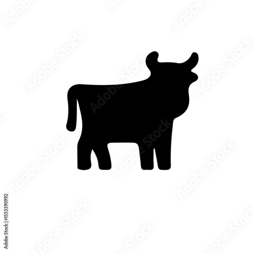 A simple black silhouette of a cow standing on white background