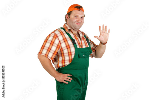 Man in overalls and a baseball cap shows five fingers on his hand.