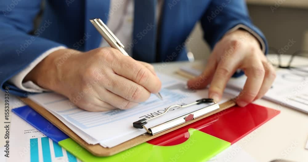 Man completes job application filling employment form signing career document at table. Workplace opportunity networking for professional advancement