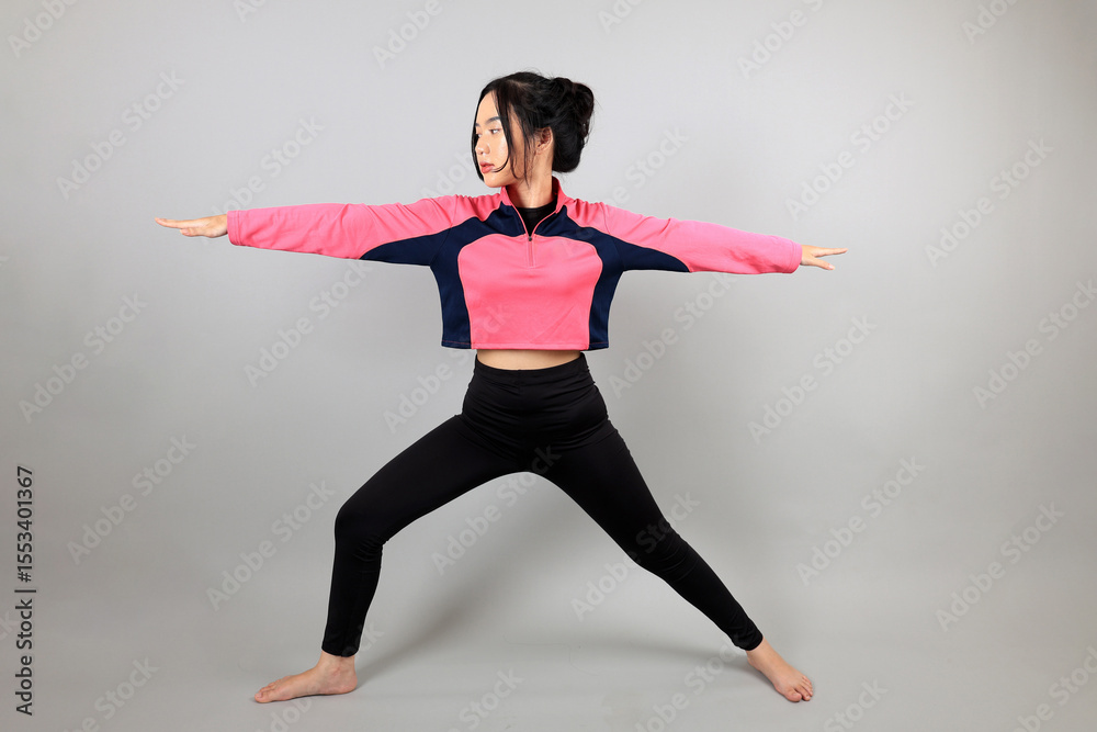 Obraz premium Young Girl doing Yoga Stretching Exercises