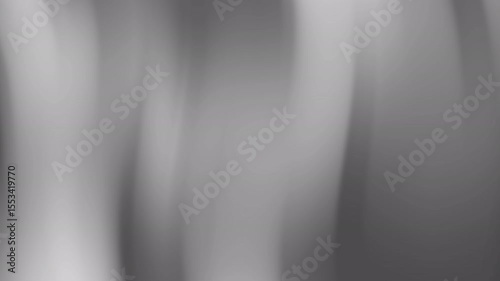 Flowing shadows reveal a monochrome abstract composition, creating a subtle yet striking visual experience with light and dark shades.