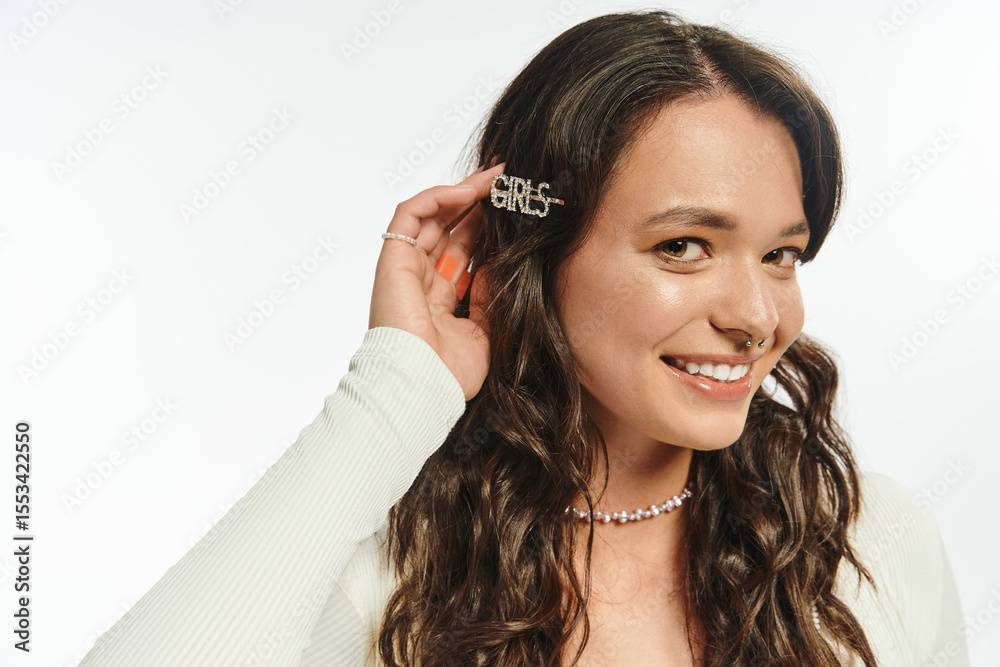 Fototapeta premium Stylish woman showcasing trendy hair accessories in a bright minimalist setting