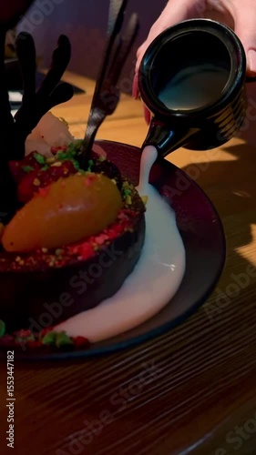 Chocolate cake with fruits, meringue, cotton candy and butter cream.