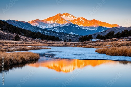 Majestic Mountain at Sunrise Reflected in Calm Lake Waters