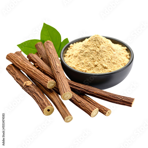 Dry licorice roots and a bowl of powdered licorice displayed with green leaves.