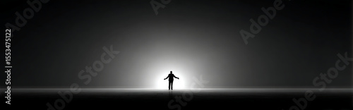 Lonely silhouette figure standing still against a glowing beige horizon in vast empty minimalistic space with soft diffused light