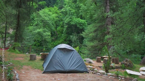 Closeup shot of tent in a campground in the middle of the forest at Manali in Himachal Pradesh, India. Camping in the wild background. Getting away from the chaos of the city and living in nature.