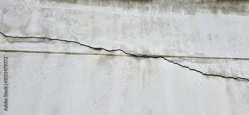 Cracks in old cement wall were visible as wide crack fissures. This may be due to mismatch of mortar according to construction principles, earthquake, subsidence. Crack from top left to bottom right. 