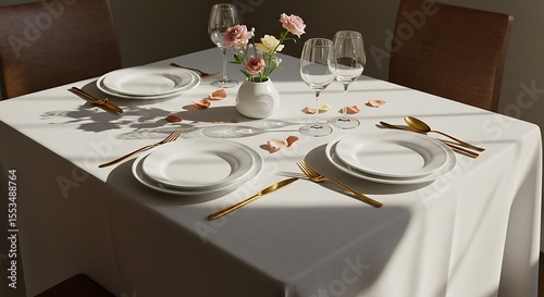 Elegant Table Setting  White Linen, Gold Cutlery, and Floral Centerpiece