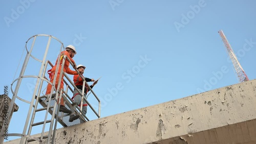 Telecommunication Engineers Working on 5G Tower,Technicians Climbing High Telecom Poles,Ensuring Network Maintenance with Safety Equipment