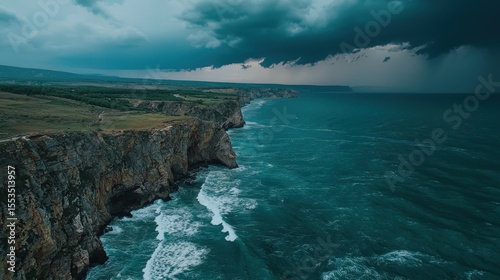 Stormy Coastal Cliffs, Drone View

Dramatic drone view of rugged cliffs plunging into stormy, dark blue seas under a heavy, cloudy sky.